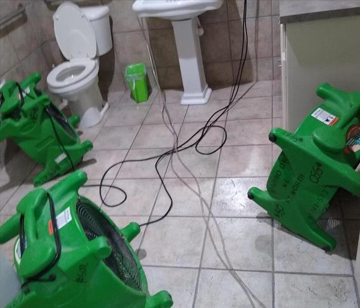 SERVPRO equipment drying restroom from a CAT 1 water loss